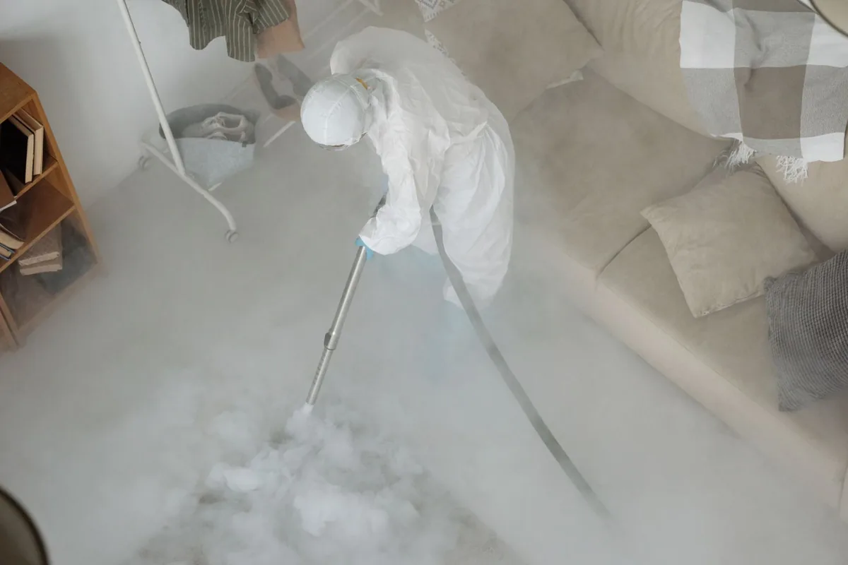 Biohazard cleanup technician in protective equipment, Oak Hill, ME